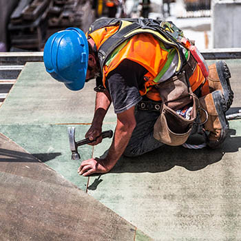 A contractor working on a roof